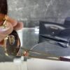 Versace oval metal kahve cam gold aksesuar 419