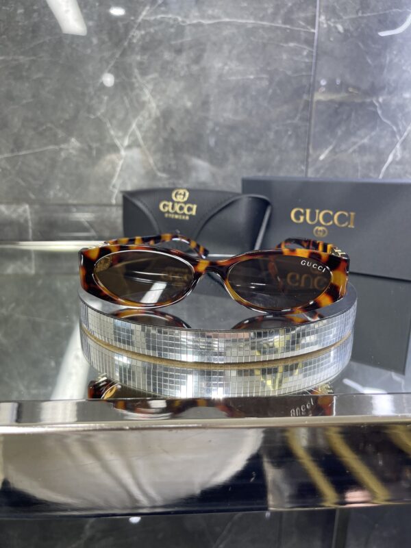 Gucci Oval Leopar çerçeve Kahve cam 558