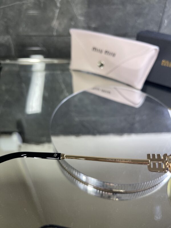 Miu Miu Oval Metal kahverengi cam 606