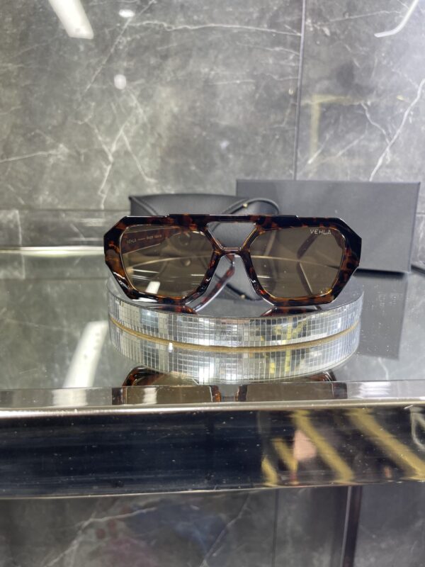 IMG_5380 Vehla leopar kemik çerçeve kahve cam 620
