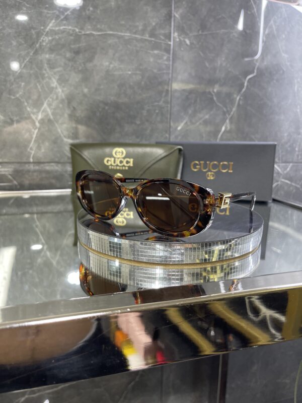 Gucci Oval Leopar Çerçeve Kahve cam 642