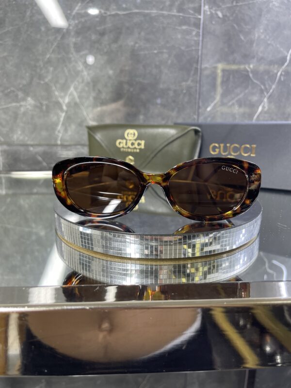 Gucci Oval Leopar Çerçeve Kahve cam 642