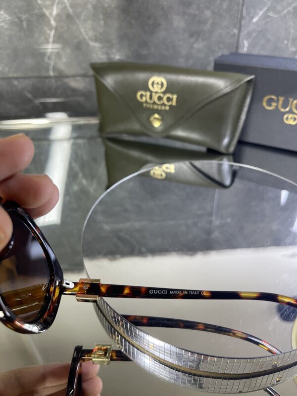 Gucci Oval Leopar Çerçeve Kahve cam 642