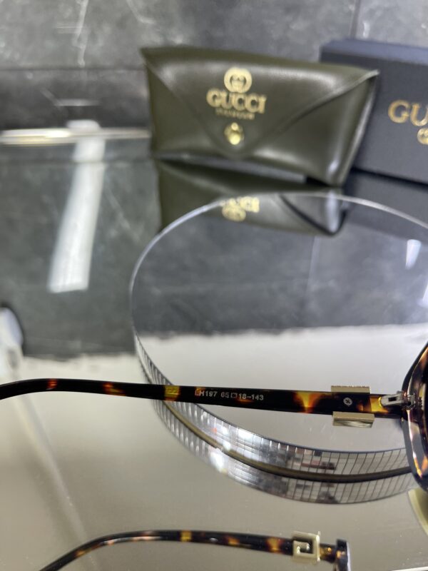 Gucci Oval Leopar Çerçeve Kahve cam 642